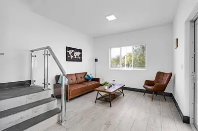 a living room with a couch and a table at Biscayne Park Villas 15400 in Miami