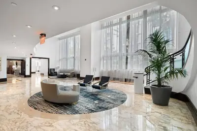 a lobby with chairs and a table in a building at FontaineBleau Resort, with Balcony 10 min from SoBe in Miami Beach