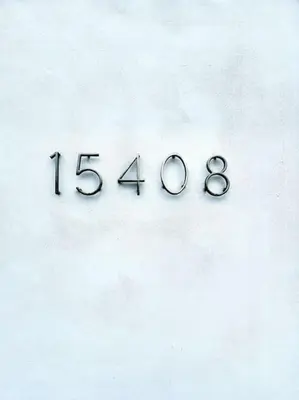 a clock on a wall with the number at Biscayne Park Villas 15408 in Miami