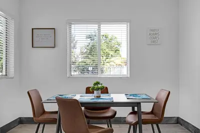 a dining room with a table and chairs at Biscayne Park Villas 15440 in Miami