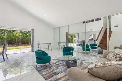a living room with a couch and chairs and a table at Spacious 3BR Villa in Miami with Fenced Backyard in Miami