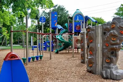 a playground in a park with a slide at BRAND NEW! Lovely 1 Bedroom with Pool by the Beach in Miami