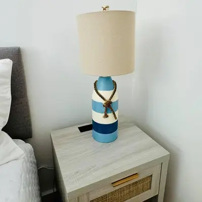 a blue and white lamp on a table next to a bed at BRAND NEW! Lovely 1 Bedroom with Pool by the Beach in Miami