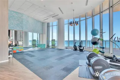 a gym with a view of the ocean at Hollywood Beachfront Apt Amazing View & Amenities in Hollywood