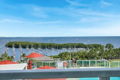 a view of a marina with boats in the water at Astonishing SEA VIEW Studio in Grove in Miami