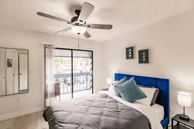 a bedroom with a bed and a ceiling fan at Miami Oasis 7 mins to Dolphin Mall MIA PS4 Games in Miami