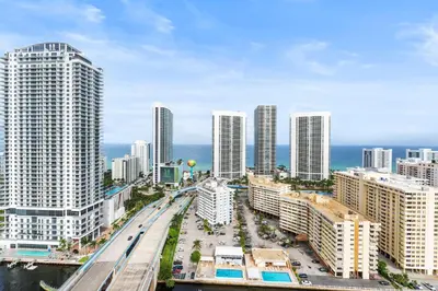 an aerial view of a city with tall buildings at Spacious Luxury Apartment at Beachwalk Resort with Ocean Views and Private Foyer in Hallandale Beach