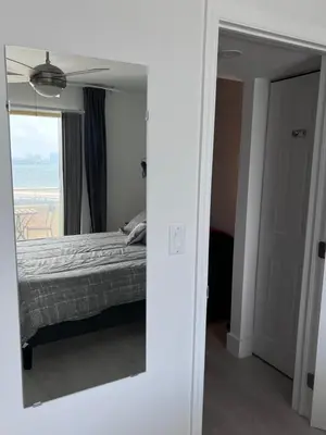a reflection of a bedroom with a bed and a mirror at Unique Water Views, free Parking 1bed 1 bath Rooffornomads 416 in Miami Beach