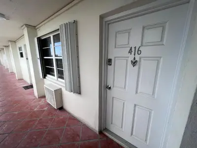 a white door with the number on the side of a building at Unique Water Views, free Parking 1bed 1 bath Rooffornomads 416 in Miami Beach