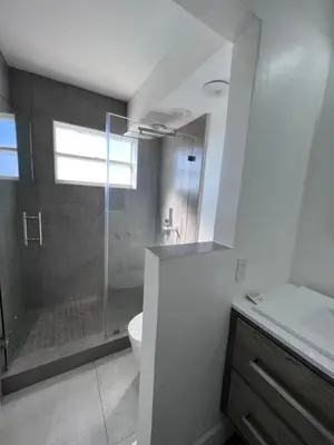 a bathroom with a shower and a toilet and a sink at Unique Water Views, free Parking 1bed 1 bath Rooffornomads 416 in Miami Beach