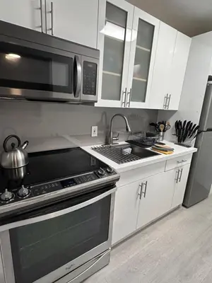 a kitchen with a stove and a microwave at Unique Water Views, free Parking 1bed 1 bath Rooffornomads 416 in Miami Beach