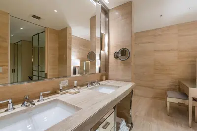 a bathroom with a sink and a large mirror at 3MM Oceanfront Residence at Finest Bal Harbour Resort - Hotel Amenities in Miami Beach