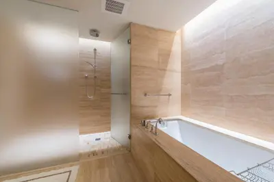a bathroom with a tub and a shower at 3MM Oceanfront Residence at Finest Bal Harbour Resort - Hotel Amenities in Miami Beach