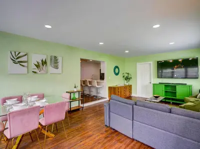 a living room with a couch and a table and chairs at Luxury Miami Casa Bonita with Tropical Pool Oasis in Miami