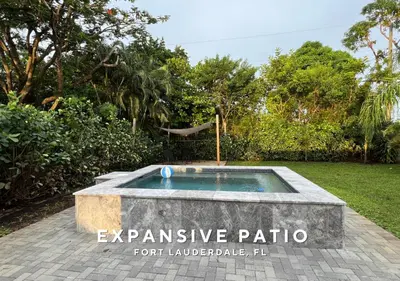 an outdoor plunge pool in a garden with trees at Private Heated Plunge Pool Spa and Secluded Patio - Fort Lauderdale in Fort Lauderdale