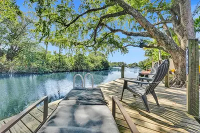 a bench sitting on a dock next to a lake at Private Waterfront Paradise in Hollywood