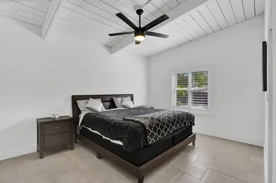 a bedroom with a bed and a ceiling fan at New ! Pool House 3-bedroom Home Victoria Park in Fort Lauderdale