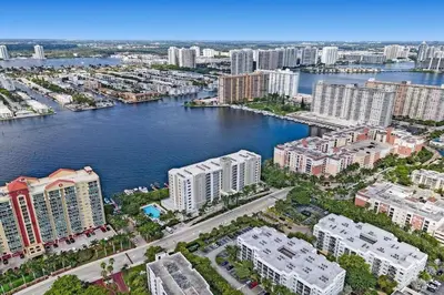 an aerial view of a city with a river and buildings at Le Petit Italie ,water View 22 With Pool in Sunny Isles Beach