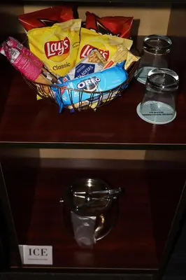 a bowl of chips and snacks on a table at Hotel TB Downtown Miami in Miami