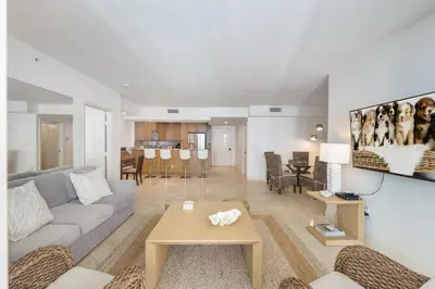 a living room with a couch and a table at Modern 2 BDR at King David with Ocean View in Sunny Isles Beach