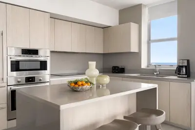 a kitchen with a bowl of oranges on a counter at Hyde Beach by Zelloo in Hollywood