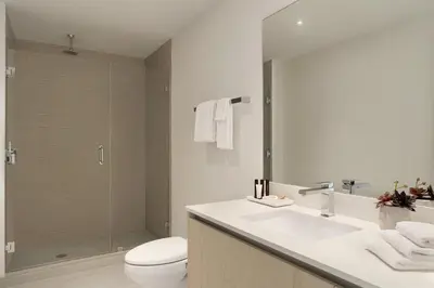 a bathroom with a toilet and a sink and a shower at Hyde Beach by Zelloo in Hollywood