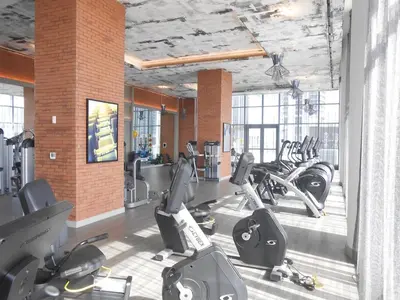 a gym with a bunch of treadms and cardio machines at Hyde Beach by Zelloo in Hollywood