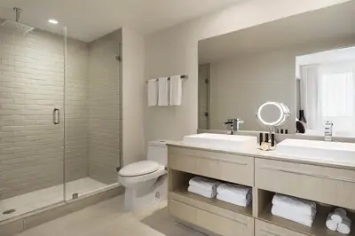 a bathroom with a toilet and a sink and a shower at Hyde Beach by Zelloo in Hollywood
