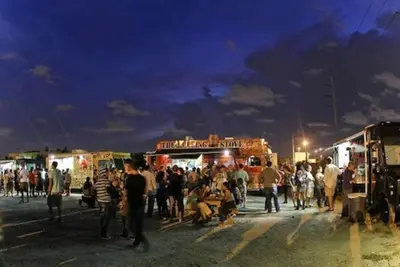 a crowd of people standing in front of food trucks at Wynwood Area with Hot Tub, 10 min from South Beach in Miami