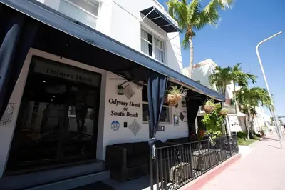 a store with a sign on the side of a building at Odyssey of South Beach Apart Hotel in Miami Beach