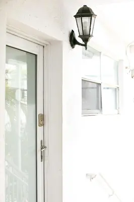a door with a light next to it at Spacious Apt in the heart of South Beach in Miami Beach
