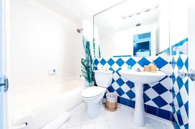 a bathroom with a white toilet and a sink at Amazing studio in Ocean Drive in Miami Beach