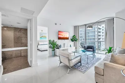 a living room with a couch and a table at Unique 1BR Icon Brickell WaterViews-Freespa in Miami
