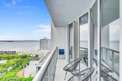 a balcony with chairs and a view of the water at Unique 1BR Icon Brickell WaterViews-Freespa in Miami
