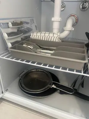 a frying pan and dishes in an open refrigerator at Excellent location Miami Brickell Studio in Miami