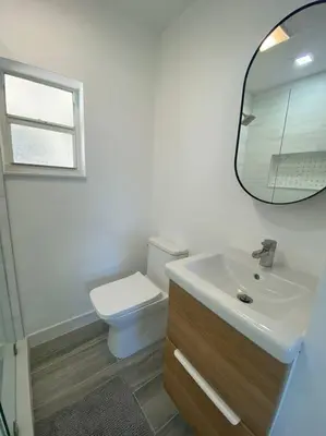 a bathroom with a sink and a toilet and a mirror at Excellent location Miami Brickell Studio in Miami