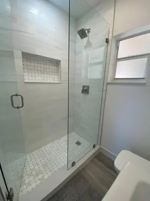 a bathroom with a glass shower with a toilet at Excellent location Miami Brickell Studio in Miami