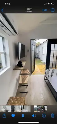 a view of a room with a bed and a window at Charming Coastal Retreat in Miami