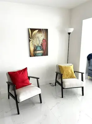 two chairs with red and yellow pillows in a room at Inactive 193 Modern, 4B&3B with Pool and Lake in Pembroke Pines