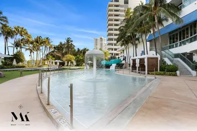 a swimming pool with a water slide in a building at FontaineBleau, Balcony w Ocean plus Bay and City View in Miami Beach