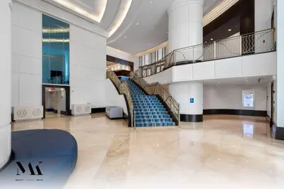 a spiral staircase in a building with a stair case at FontaineBleau, Balcony w Ocean plus Bay and City View in Miami Beach