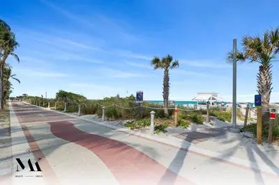 a road next to the beach with palm trees at FontaineBleau, Balcony w Ocean plus Bay and City View in Miami Beach
