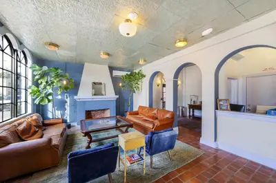 a living room with couches and a table at Tower Hotel Little Havana in Miami