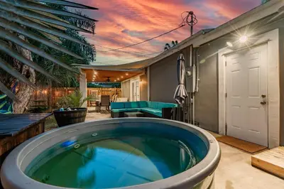 a jacuzzi tub in the backyard of a house at Zen Retreat - Sauna Pool Cold Plunge & More in Fort Lauderdale