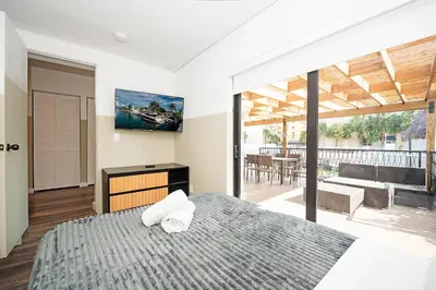 a bedroom with a bed with two towels on it at Luxury RiverFront By Renzzi in Miami