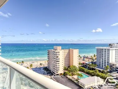 a view of the beach from the balcony of a building at W FTL 1409 Beachfront Resort 2 Bedroom & 2 Bathroom Condo in Fort Lauderdale