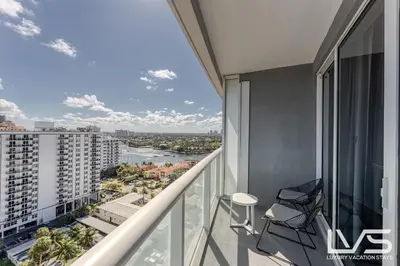 a balcony with a view of a city at W FTL 1409 Beachfront Resort 2 Bedroom & 2 Bathroom Condo in Fort Lauderdale