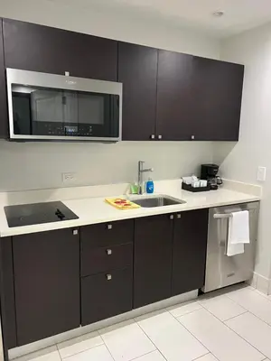 a kitchen with a sink and a microwave at Doral Pool 404 by Wave Properties in Miami