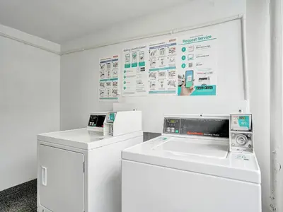 a white laundry room with a washer and dryer at Luxury Penthouse 3BR 3BA Oceanfront PH7 in Miami Beach
