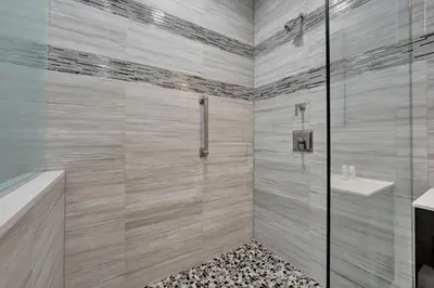 a bathroom with a shower and a sink at Luxury Penthouse 3BR 3BA Oceanfront PH7 in Miami Beach
